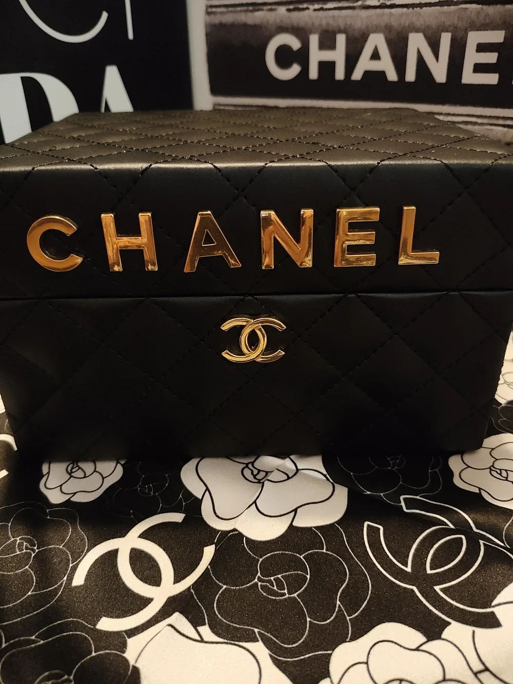 Black Quilted Jewelry Case with Gold Logo Accents And Mirror